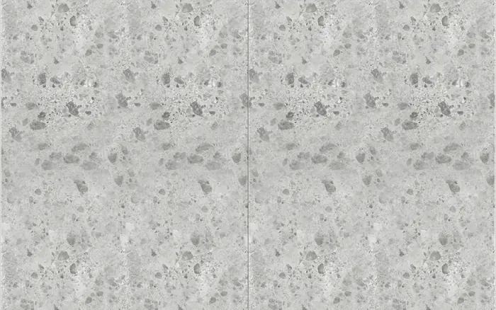 Large-format porcelain slab with a fine grey terrazzo aggregate.