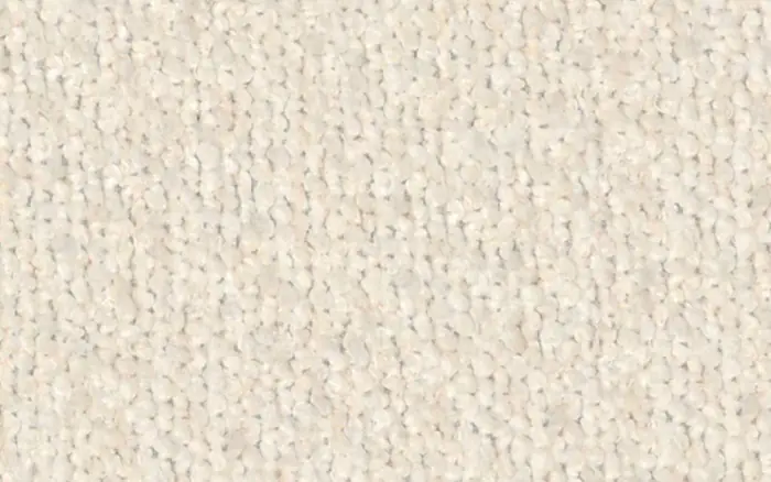 Close view of a cream bouclé upholstery fabric.